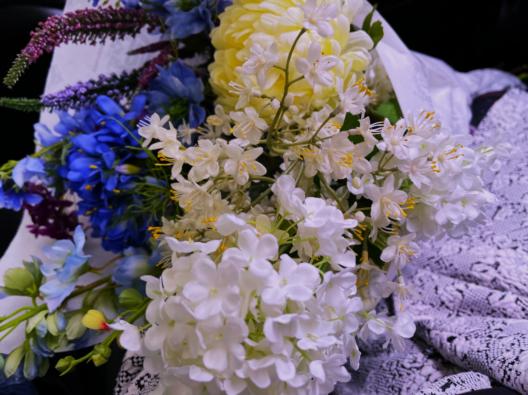 White hydrangea with blue and violet stems